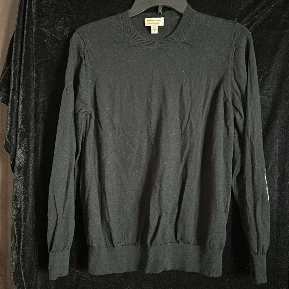 Black Burberry sweater.